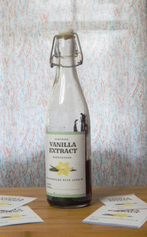 photo of DIY vanilla bean extract in a glass bottle and printable label